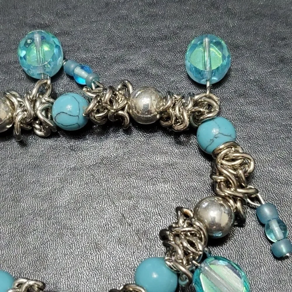 Child's silver tone blue bead bracelet 6